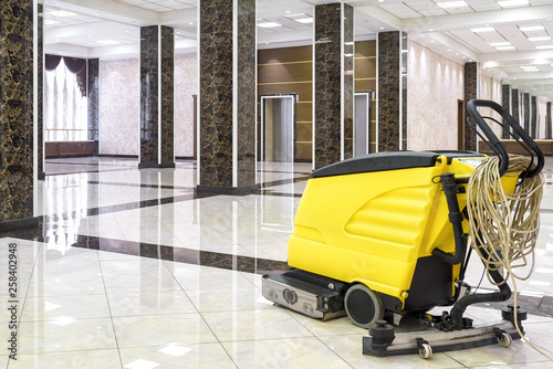 Cleaning Machine In The Empty Office Lobby Yellow Vacuum