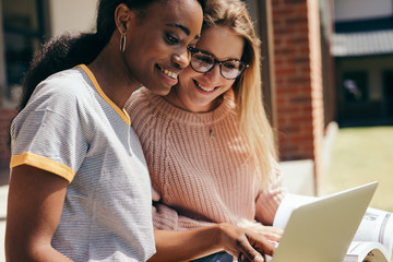 Students at university campus with laptop