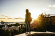 © sebastiancaptures - Sunset in Malaga, Spain. Young travelling woman looking in the horizon.