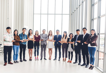 Group of professional casual business people team looking confidently at camera in modern office.Teamwork concept