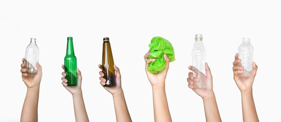 Wall Mural - hand holding garbage of bottle glass and bottle plastic with plastic bag isolate on white background