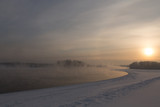 Fototapeta Dziecięca - winter frosty sunset on the river in Siberia in winter