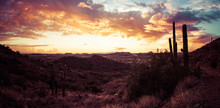 A Panorama Featuring A Sunset In The Desert Outside Of Phoenix, AZ.  This Image Looks To The West With Saguaro Cactus And Mountainous Desert Terrain.