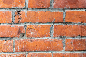 Old orange brick wall with cement texture background.