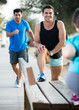 © JackF - Smiling adult men are warming-up