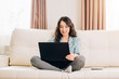 © liliyabatyrova - Bbeautiful woman using laptop computer at home on sofa