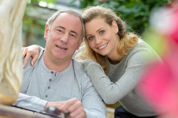 portrait of caucasian woman embracing her father