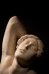 Detail of an ancient marble statue of a woman