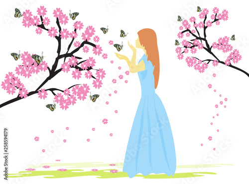 Photographie  A woman in a blue dress under a tree with pink flowers has a white background