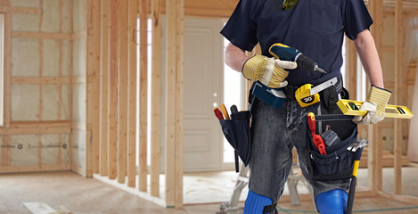 Wall Mural - Builder handyman with drill tools.