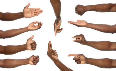 Afro-American man showing different gestures on white background, closeup view of hands