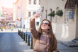 © bisonov - Attractive young woman taking selfie