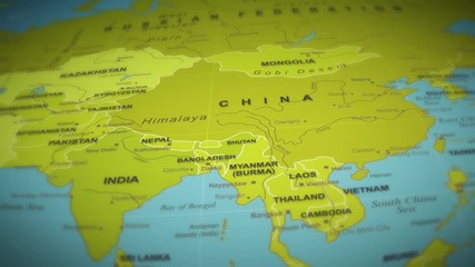 Wall Mural - World Map Flight Over Background/ 4k animation of a world map travel background flight over with ocean, countries and cities names