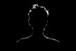 Leinwandbild Motiv silhouette of man in dark place, anonymous backlit contour a