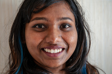 attractive Indian girls posing front of camera..Closeup portrait of young beautiful woman. Positive emotions feelings facial expression, sign andsymbols, body language