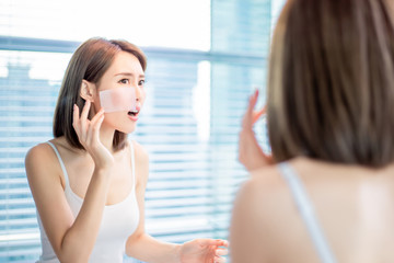 Wall Mural - woman use oil blotting paper