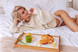 © zinkevych - Slim sexy good-looking woman eating little marshmallow in bed