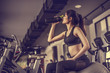 © Take Production - young fitness woman tired in gym drink   protein shake.exercising concept.fitness and healthy lifestyle