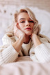 © zinkevych - Young beautiful woman with natural makeup lying in bed