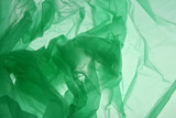 Fototapeta Konie - Plastic bag concept. Polyethylene as smoke may use as background. Emerald green textured gradient. Background for design. Template for card, poster, banner design.