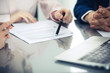 © rogerphoto - Group of business people and lawyers discussing contract papers. Success at meeting or negotiation