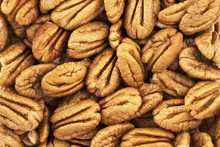 Top View On Background Texture Of Pecan Nuts. Copy Space For Text.