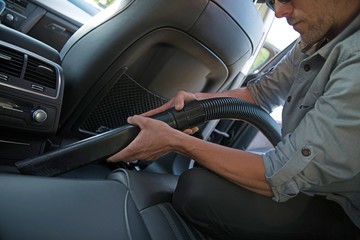 Wall Mural - Men Vacuuming His Car