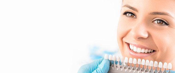 Wall Mural - Beautiful smile and white teeth of a young woman.