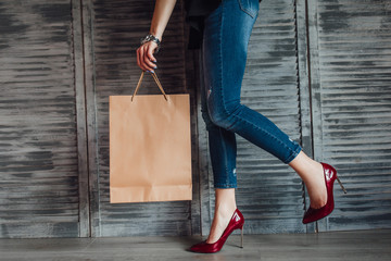 Wall Mural - Shopaholic woman in the city. The concept of shopping, sales and purchases of things.