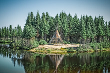 Native American Tipi Reflecting In The Lake