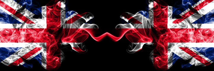 Wall Mural - United Kingdom vs United Kingdom, British smoky mystic flags placed side by side. Thick colored silky smoke flags of Great Britain and United Kingdom, British.