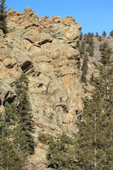 Climbers on rock wall in Rocky Mountains National Park, Colorado