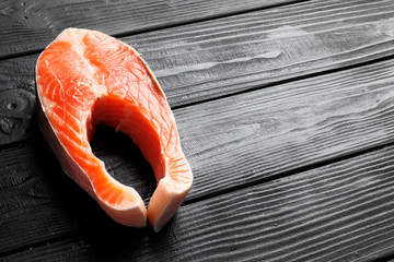 Cut fresh salmon on a wooden table