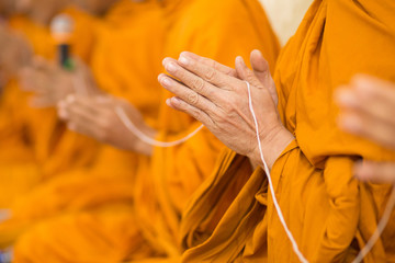 Buddhist monk's hand Is in the ceremony