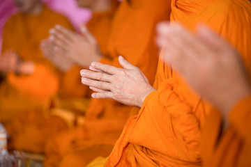 Buddhist monk's hand Is in the ceremony