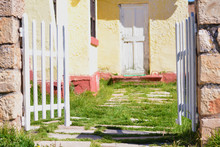 Entrance Of Yellow Rural House.