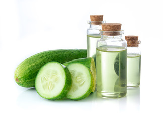 Canvas Print - Cucumber slices with cucumber essential oil in glass bottle on white background