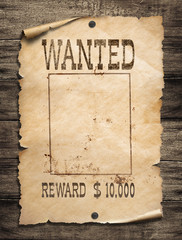 wanted wild west poster on wood background