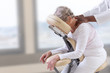 © JPC-PROD - Senior woman getting massage in chair in therapy room