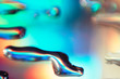 abstract chromatic background with liquid drops on mirror
