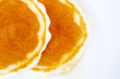 canvas print picture - Image of pancakes dripped with wild honey on a dish close up.