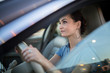 © lightpoet - Pretty, young woman  driving a car -Invitation to travel. Car rental or vacation.