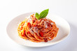 canvas print picture - Spaghetti in a dish on a white background