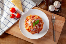 Spaghetti In A Dish On A Wooden Background