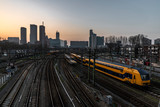 Fototapeta  - The Hague (Den Haag in Dutch) skyline during the sunset moment behind the train station