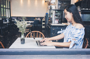 Wall Mural - woman using laptop computer online shopping.