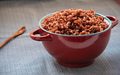 Wall Mural - Cooked red rice on the table. Vegetarian food. Healthy food.