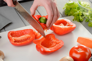 Wall Mural - Man cut a bell pepper