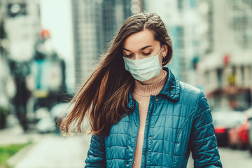 Wall Mural - Woman wearing medical mask on street. Protection against virus, infection, exhaust and industrial emissions in urban. Air pollution and epidemic in city. Epidemic concept