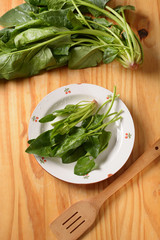 Wall Mural - spinach leaves washed in white dish